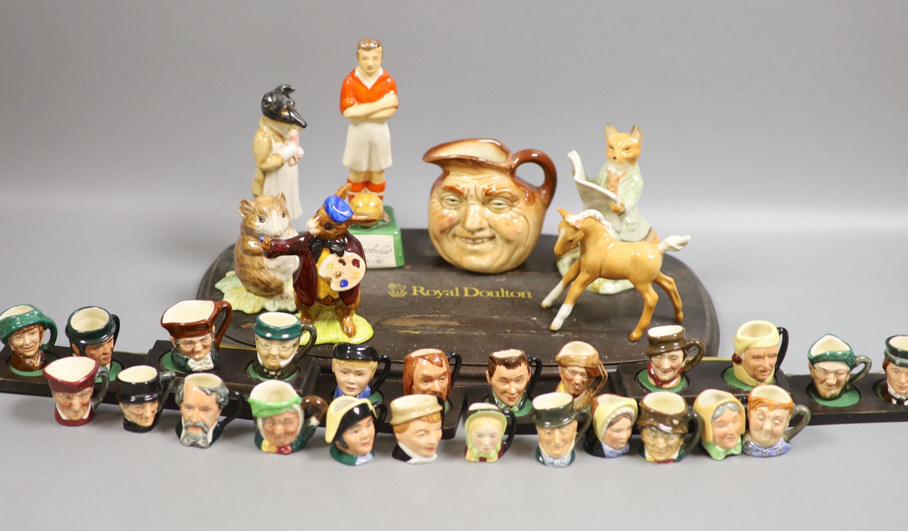 A collection of Royal Doulton miniature character mugs, figurines, series plate etc